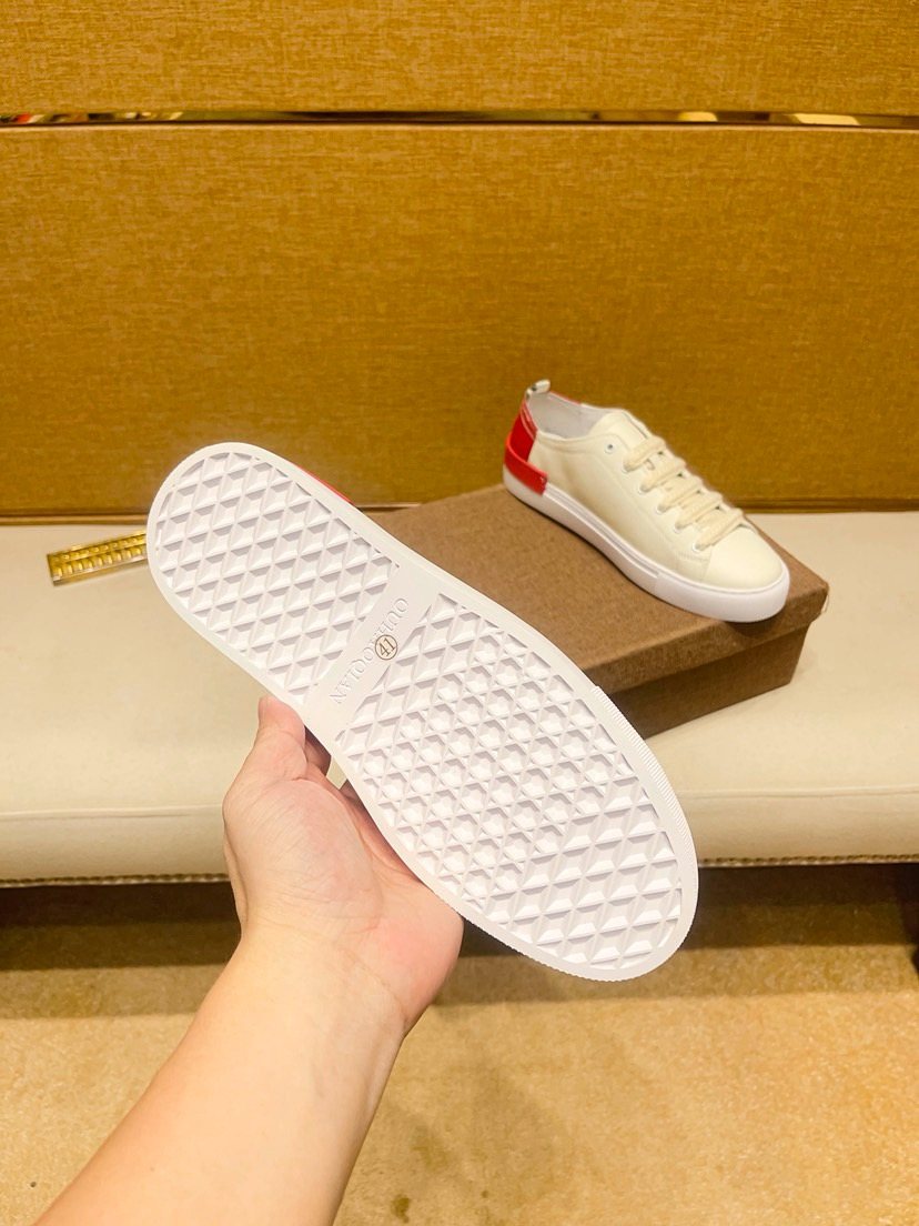 White Low-Top Sneakers with Red Floral Accents — detail